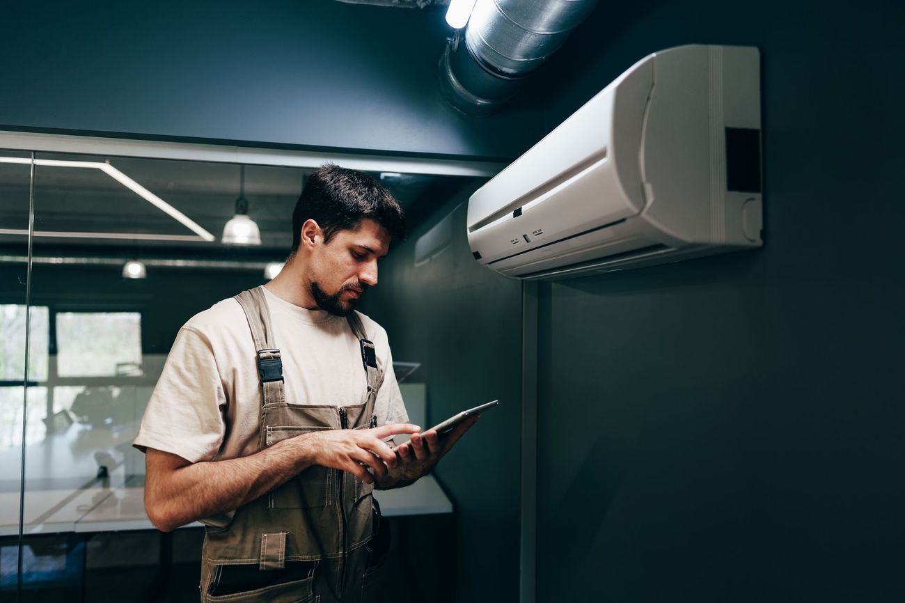 Technician reviewing garage door inspection report